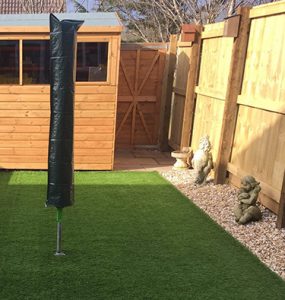 Residential property back garden with fake turf, Exmouth, East Devon