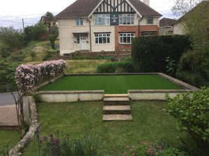 Finished raised front garden with fitted artificial grass in Sidmouth, East Devon
