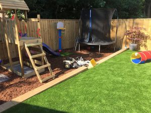 Artificially grassed and play areas in Exmouth garden