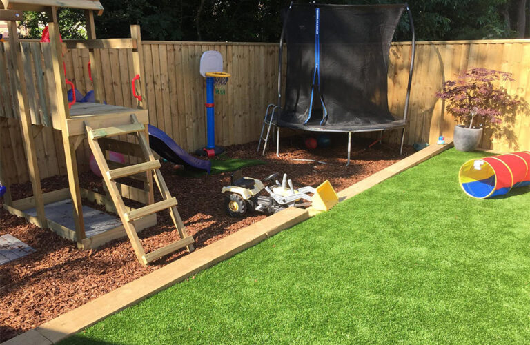 Artificially grassed and play areas in Exmouth garden