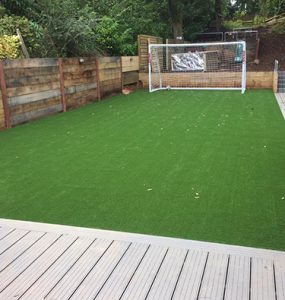 Garden with large artificially turfed area for children to play football