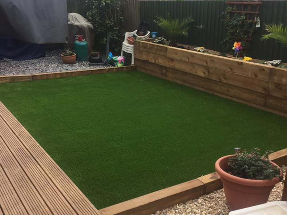 Our premium grass in place, creating brand-new garden party area