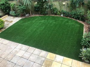 Landscaped garden in Exmouth with new grass and paving by Alpyne Grass