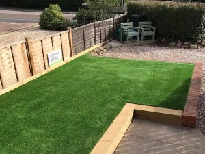 Transformed front garden shown with our artificial lawn