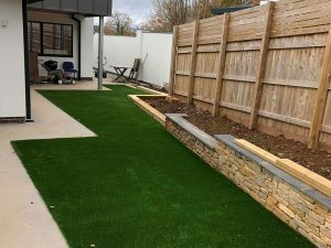 Back garden artificial lawn at new build development Exeter