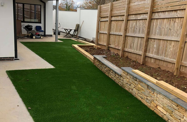 Back garden artificial lawn at new build development Exeter
